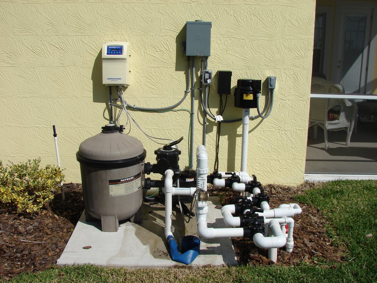 Residential pool equipment pad with filter, valves, and plumbing